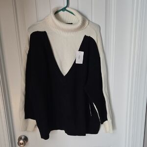 Eloquii Two-Tone Black and Cream Turtleneck Sweater